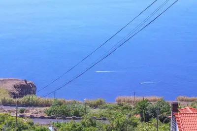 a view of the blue ocean with power lines at Studio One | Massapez | Fajã da Ovelha | Calheta in Fajã da Ovelha