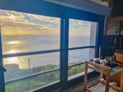 a room with a window with a view of the ocean at Studio One | Massapez | Fajã da Ovelha | Calheta in Fajã da Ovelha