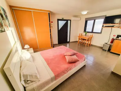 a bedroom with a bed with two pillows on it at Studio Two | Massapez | Fajã da Ovelha | Calheta in Fajã da Ovelha