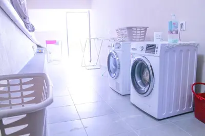 a laundry room with a washer and a washing machine at Studio Two | Massapez | Fajã da Ovelha | Calheta in Fajã da Ovelha