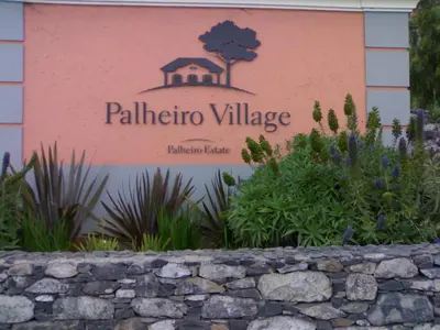 a sign for a villa village in a garden at Luxury two bedroom Palheiro Village by Holiday Rental Madeira in Funchal