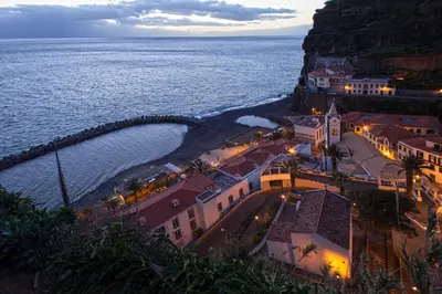 an aerial view of a town near the ocean at night at Estalagem Da Ponta Do Sol in Ponta do Sol