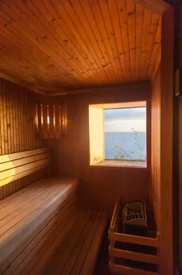 a sauna with a window in a wooden cabin at Estalagem Da Ponta Do Sol in Ponta do Sol
