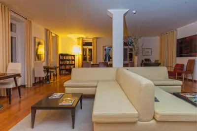 a living room with a couch and a table at Estalagem Da Ponta Do Sol in Ponta do Sol