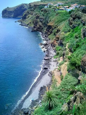 an aerial view of a beach on a hill with the ocean at Inn & Art Madeira in Caniço