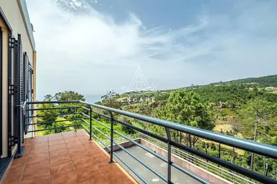a balcony with a view of the ocean at Vila Sol in Prazeres