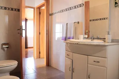 a bathroom with a sink and a toilet at Casa Bela Vista in Ribeira Brava