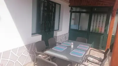 a bedroom with a large bed and a mirror at Vila Pragelas in Santa Cruz