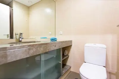 a bathroom with a toilet and a sink and a mirror at Elena's Apartment - Nice sea views in Panasqueira