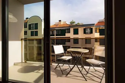 a view of a balcony with a table and chairs at Elena's Apartment - Nice sea views in Panasqueira
