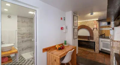 a bathroom with a sink and a counter with a sink at OurMadeira - Cottage do Mar in Arco da Calheta