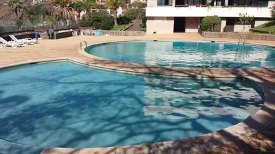 a large swimming pool with blue water at Shearwaters - Sounds of the sea in Funchal