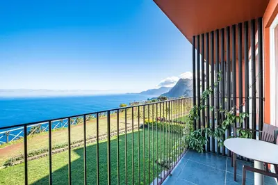a balcony with a view of the ocean at Hotel Quinta Do Furao in Santana