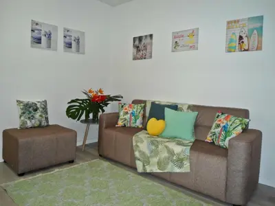 a living room with a couch and a chair at Terrace Apartment in Funchal