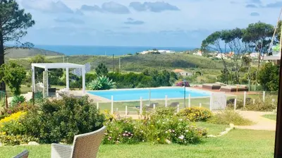 a view of a swimming pool from a garden at Herdade Monte Do Sol in Aljezur