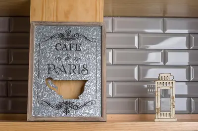 a sign with a cup of coffee on a shelf at Ivens Residence in Funchal