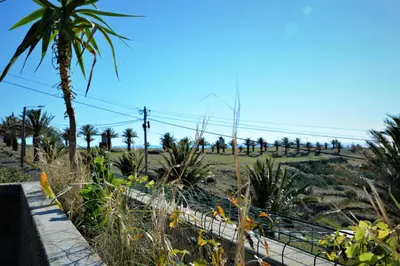 a balcony with chairs and a table on a building at Porto Santo Balcony View House in Porto Santo