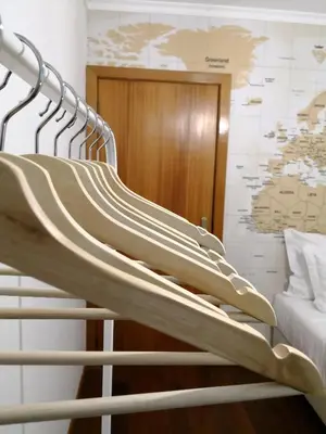 a metal staircase in a room with a bed at Travellers Pearl by Storytellers in Funchal