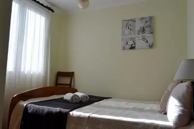 a bedroom with a bed with two towels on it at Bela Vista in Funchal