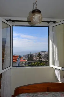 a window with a view of a city at Bela Vista in Funchal