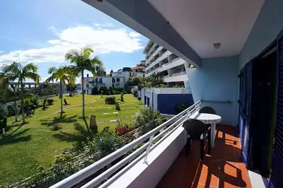 a balcony with a view of a yard at Your Home In Madeira III in Funchal