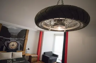 a large ceiling light in a room at Modern & Recycled Guest House in Machico