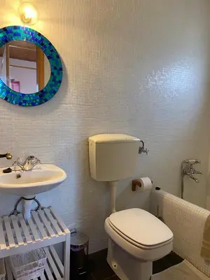 a bathroom with a toilet and a sink at Casa Pedralva in Vila do Bispo