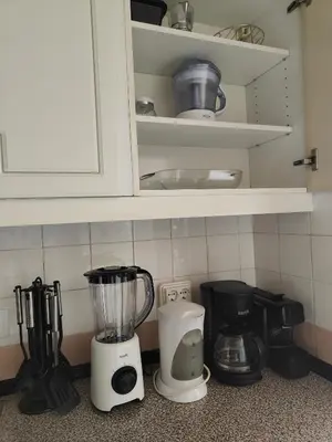 a kitchen counter with a blender and other appliances at Marina Club Apartment in Funchal