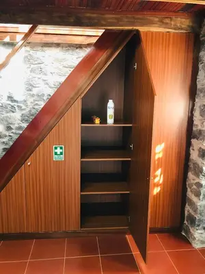 a closet under the stairs in a house at Casa do Lugar da Ribeira in Ribeira Brava