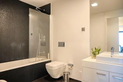 a bathroom with a toilet and a sink at Seculo XXI-U, a Home in Madeira in Funchal