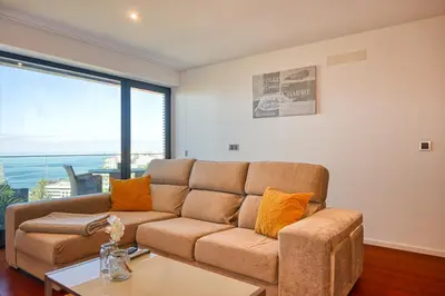 a living room with a couch and a table at Seculo XXI-U, a Home in Madeira in Funchal
