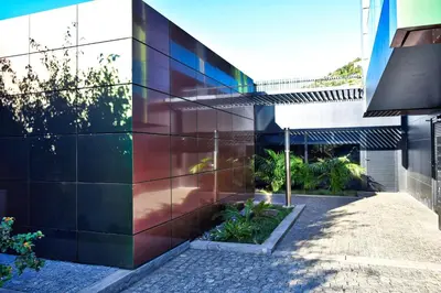 a facade of a building with a garden at Seculo XXI-U, a Home in Madeira in Funchal
