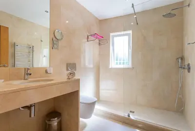 a bathroom with a shower and a toilet and a sink at CoolHouses Algarve, Casa Redonda, V3 Lagos in Lagos