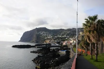 a sunset over the ocean with the sun setting at Cozy Duplex Retreat by Green Park & Ocean View in Funchal
