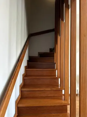 a staircase in a house with wooden floors at Cozy Duplex Retreat by Green Park & Ocean View in Funchal