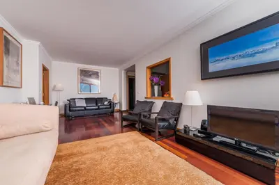 a living room with a large flat screen tv at Falesia Apartment by LovelyStay in Funchal
