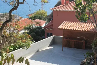 a house with a door on the side of it at Casa da Fininha in Calheta