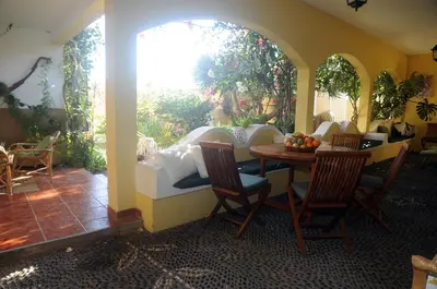 a room with a table and chairs and a window at Villa Ines, at the beach in Porto Santo