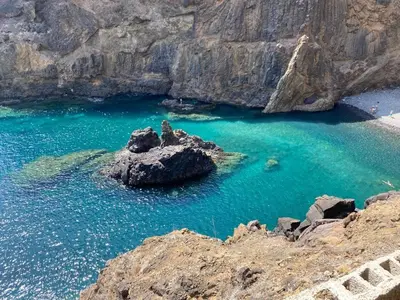 a rock in the middle of a body of water at Villa Ines, at the beach in Porto Santo