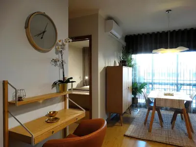 a dining room with two chairs and a table at AP Charme Anadia in Funchal