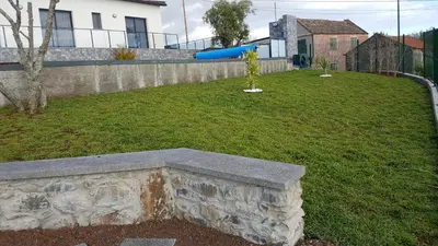 a blue frisbee flying through the air in a yard at Villa Guiné in Arco da Calheta
