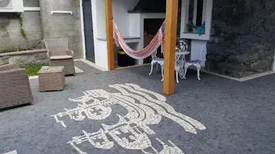 a drawing of a bicycle is painted on the ground at Casa do Leme in Arco da Calheta