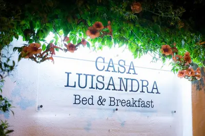 a sign that reads casa lubbockenda bed and breakfast at Casa Luisandra Boutique Hotel B&B in Luz