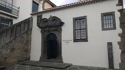 a white building with a door on the side of it at Central Suite in Funchal 1N in Funchal
