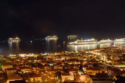 a city lit up at night with a cruise ship at Central Suite in Funchal 1N in Funchal