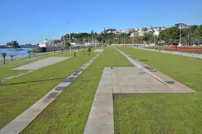 a park with benches in the middle of the grass at Central Suite in Funchal 2N in Funchal