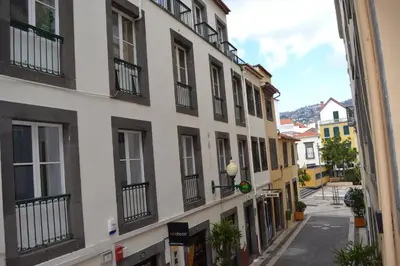 an alley in a city with buildings at Central Suite in Funchal 2N in Funchal