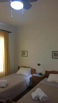 a bedroom with two beds and a ceiling at Central Suite in Funchal 3N in Funchal