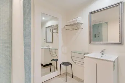 a bathroom with a sink and a mirror at Funchal Marina Bay in Funchal