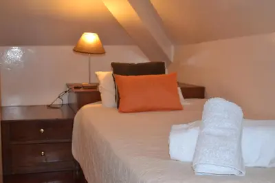 a bedroom with a bed with a lamp on it at Central Studio in Funchal 3S in Funchal